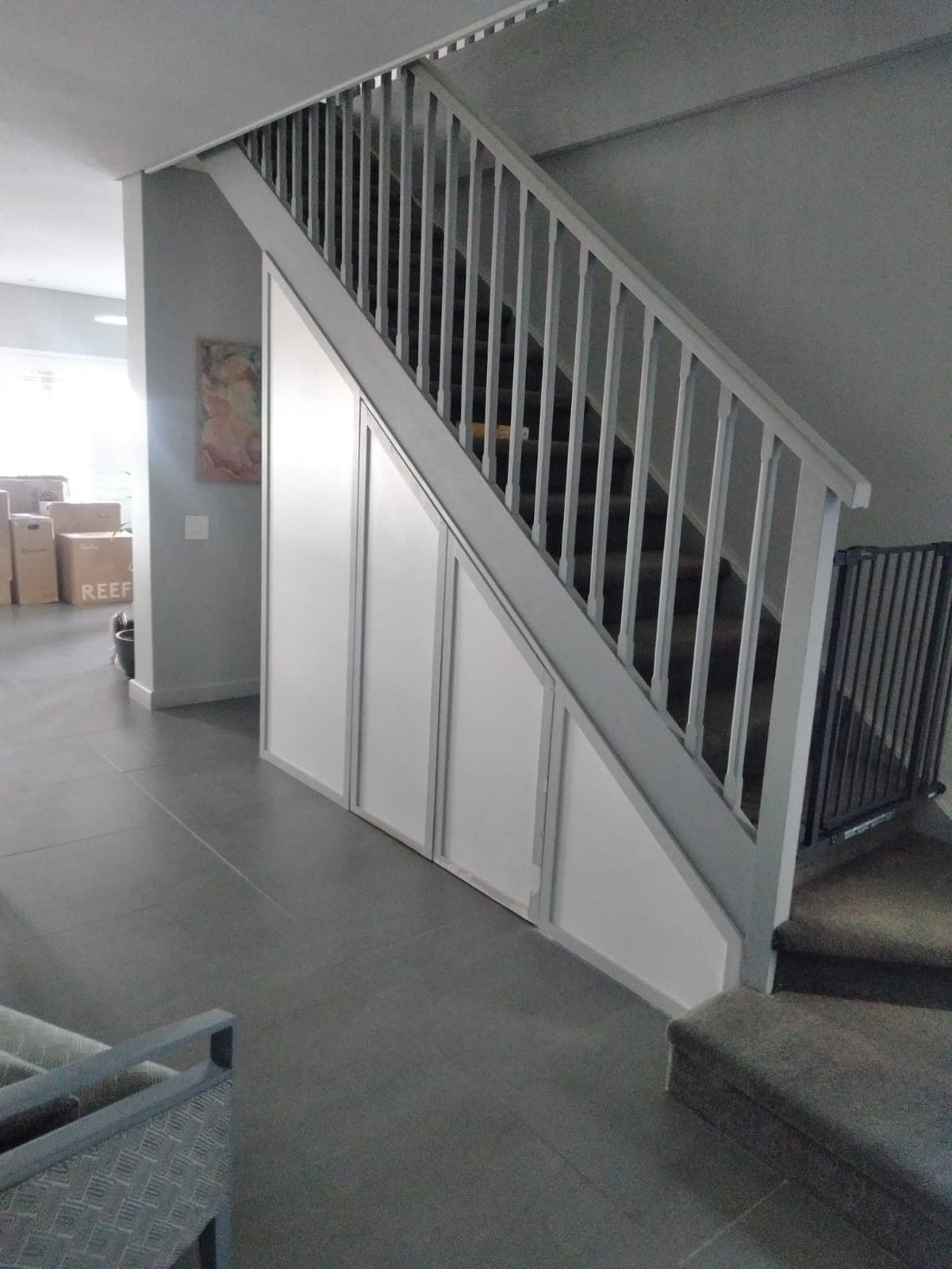 Custom under-stair storage cupboards built by Bruce Handyman