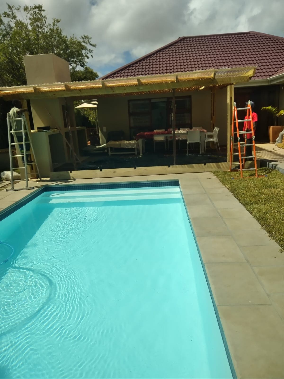 Sparkling turquoise pool renovated by Bruce Handyman in Cape Town